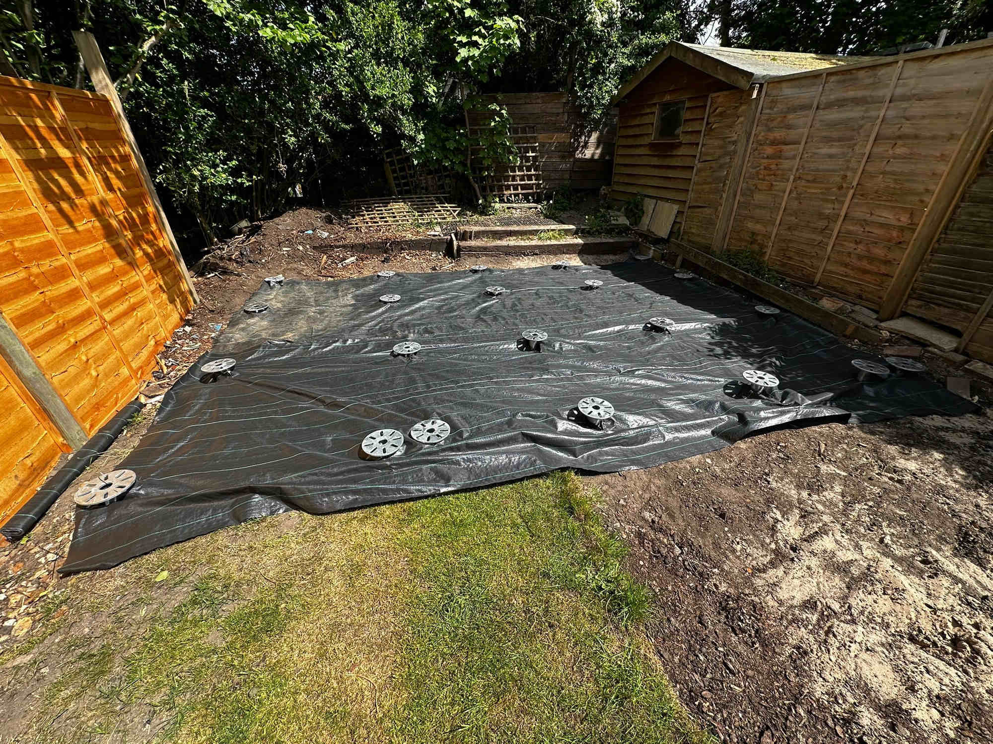 Clean completed foundation in a summer garden