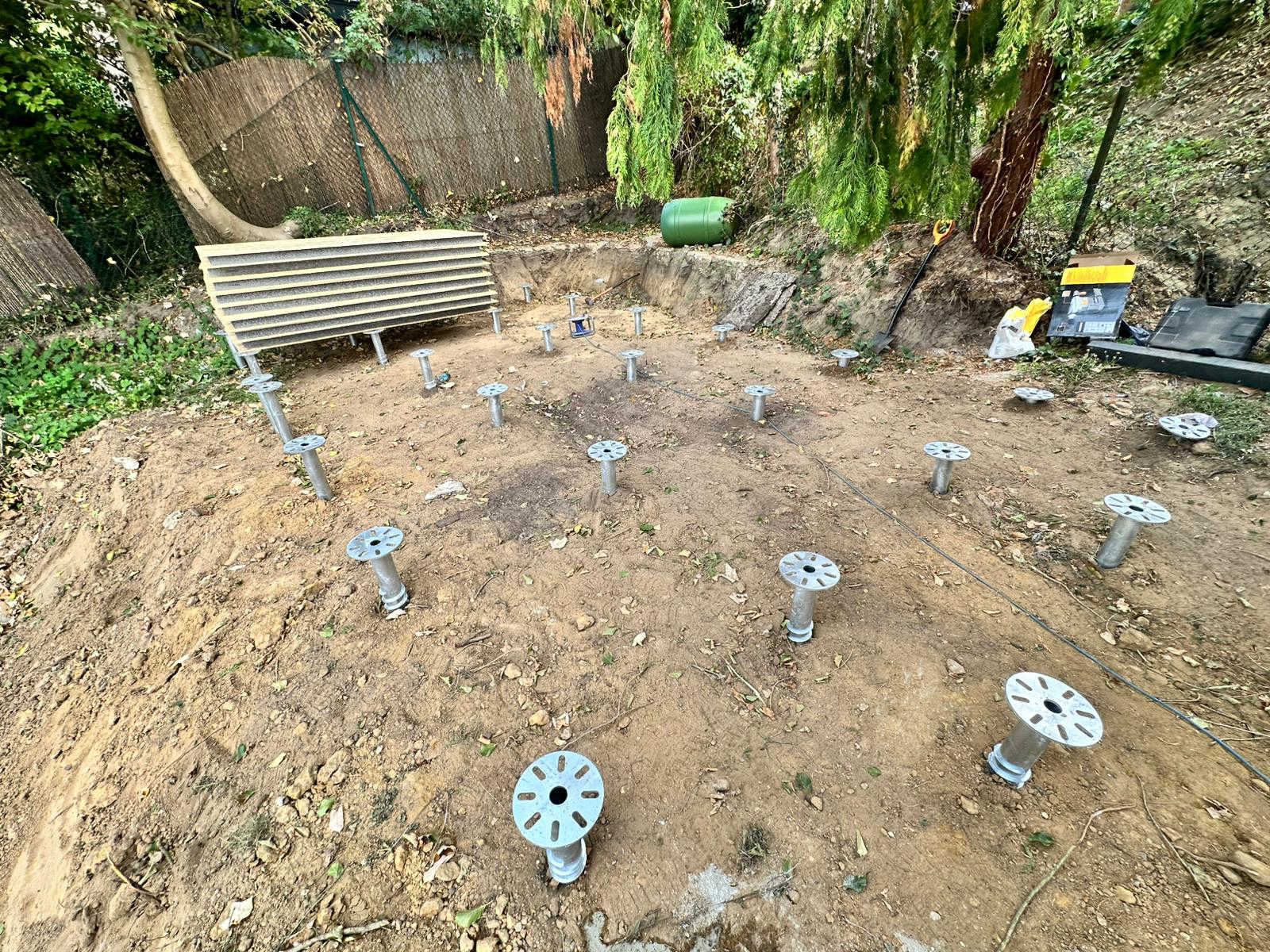 Screws on a sloped clay garden — levelled without digging